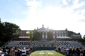 An outdoor graduation ceremony. Link to Gifts of Real Estate