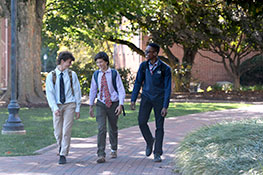 Three students walking through campus. Link to Gifts That Pay You Income